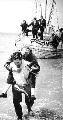 Fred Downs carries landlubber ashore
