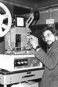Mike Craig laces a film on 16mm projector