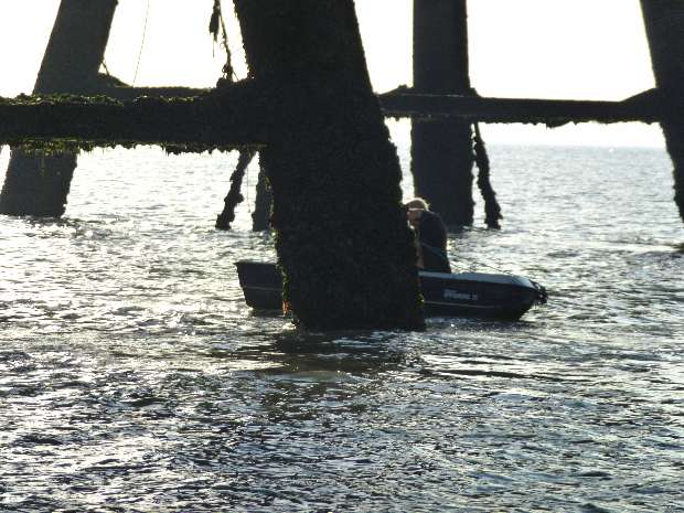 Tony Pine in dingy below G1