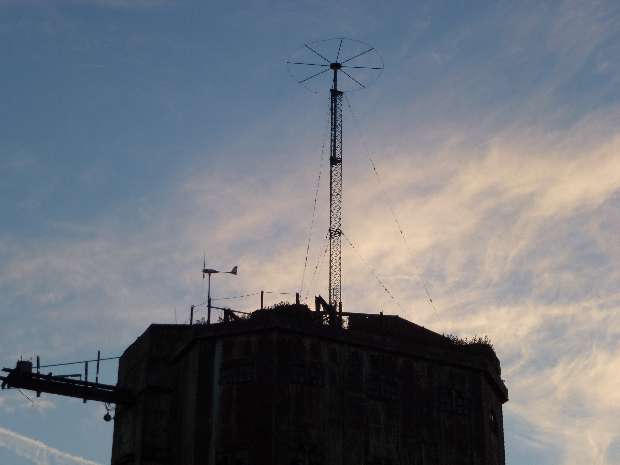 Radio antenna with wind turbine