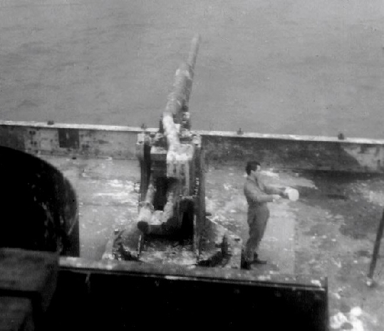 Cliff Coutelle cleans sauncepan on deck