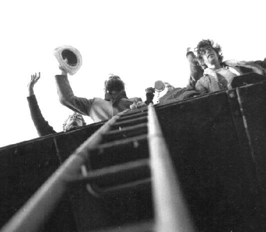 Tower crew looking up landing ladder