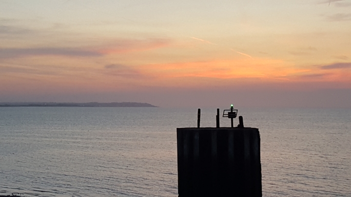 Dolphin Navigation light with Whitstable sunset